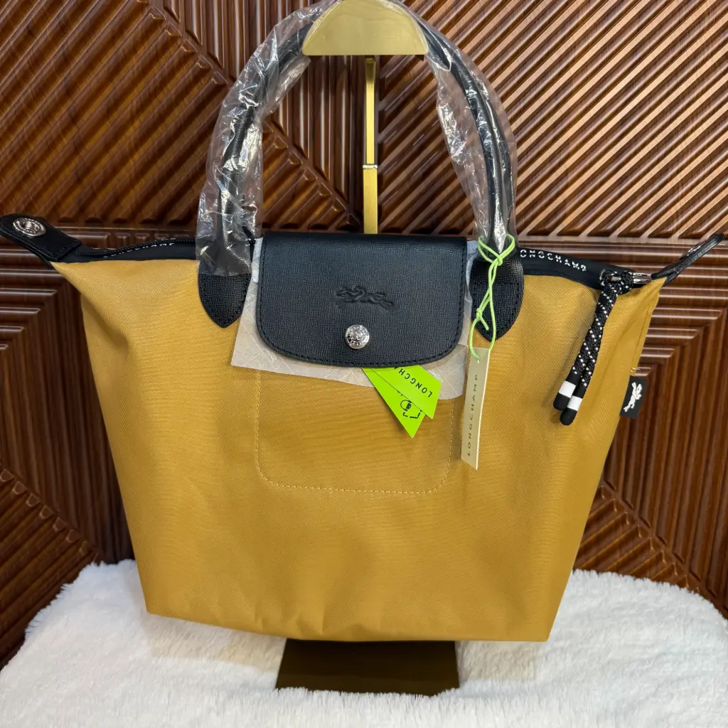 LONGCHAMP Bolsa Le Pliage Mini L Dorada Arena