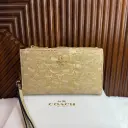 COACH Cartera Muñequera Porta Celular Beige Holograma
