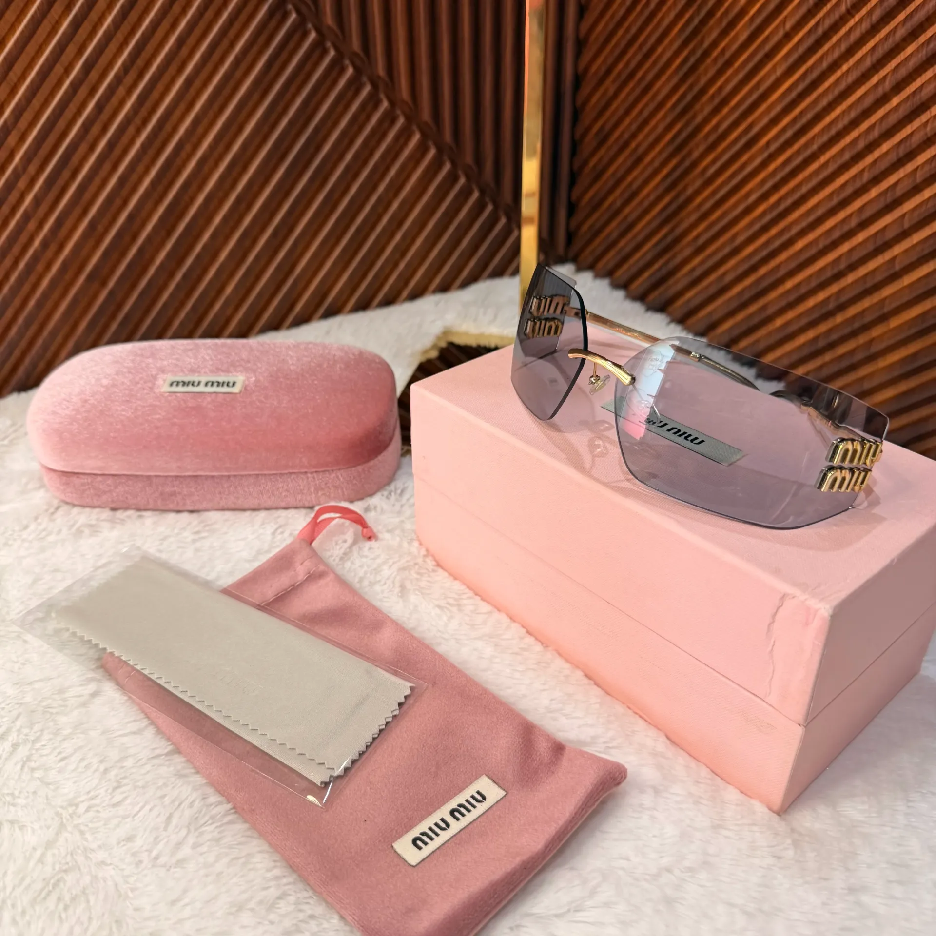 MIU MIU Lentes Runaway Lente Azul, Armazón Dorado