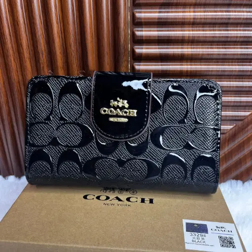 COACH Cartera Mediana Relieves Negro Charol